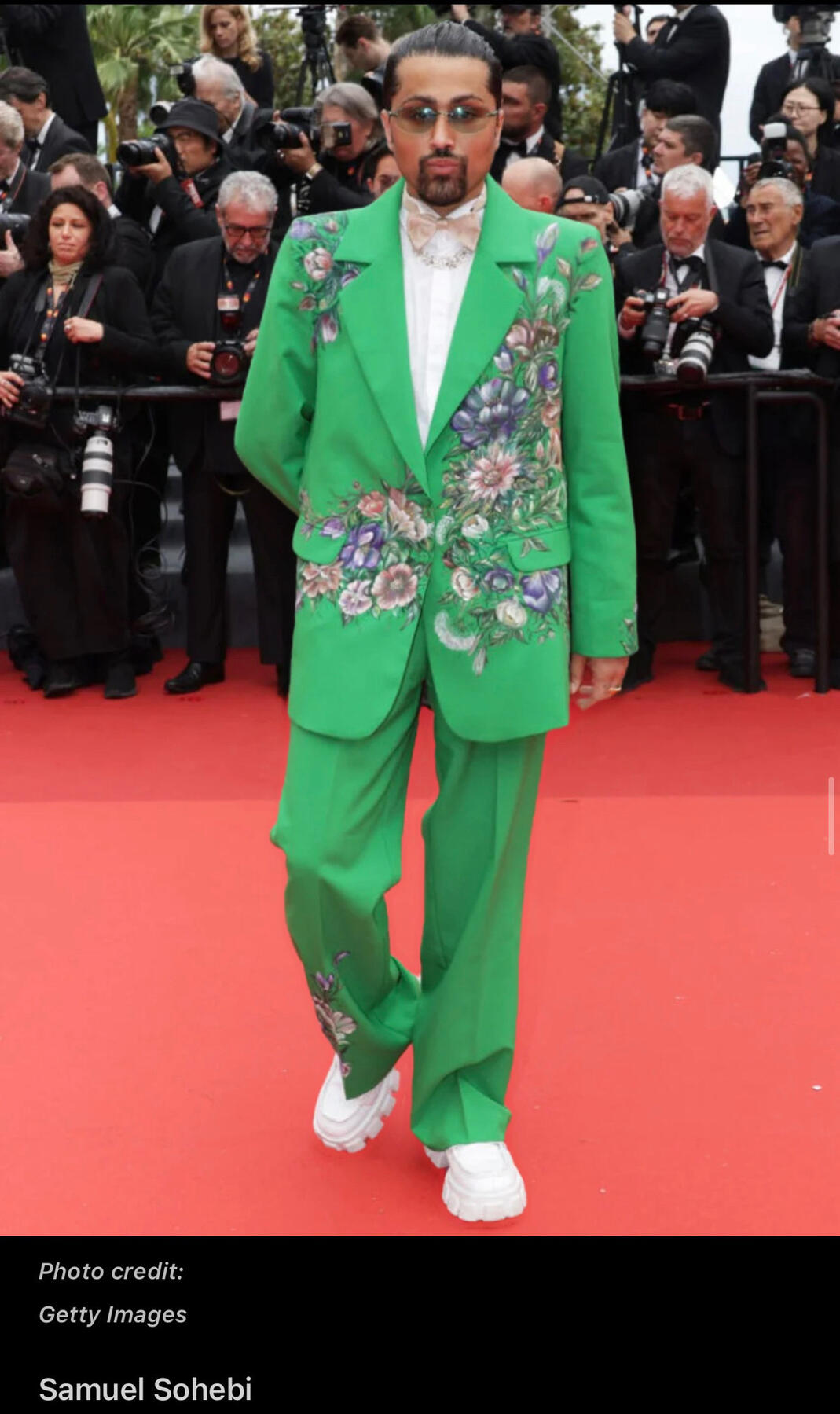 Samuel Sohebi at the Cannes Film Festival premiere (“Killers of the Flower Moon”, 2023), featured in The Wrap, wearing a tailored Maison Novague suit on the red carpet.